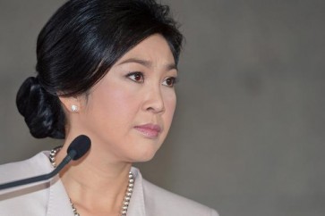 Thai Prime Minister Yingluck Shinawatra listens to a question from the media during a press conference at the Army Club in Bangkok on December 10, 2013. Thailand's premier called a snap election to try to defuse the kingdom's political crisis, but protesters vowed to keep up their "people's revolution" as an estimated 140,000 demonstrators flooded the streets of Bangkok. AFP PHOTO / PORNCHAI KITTIWONGSAKUL        (Photo credit should read PORNCHAI KITTIWONGSAKUL/AFP/Getty Images)